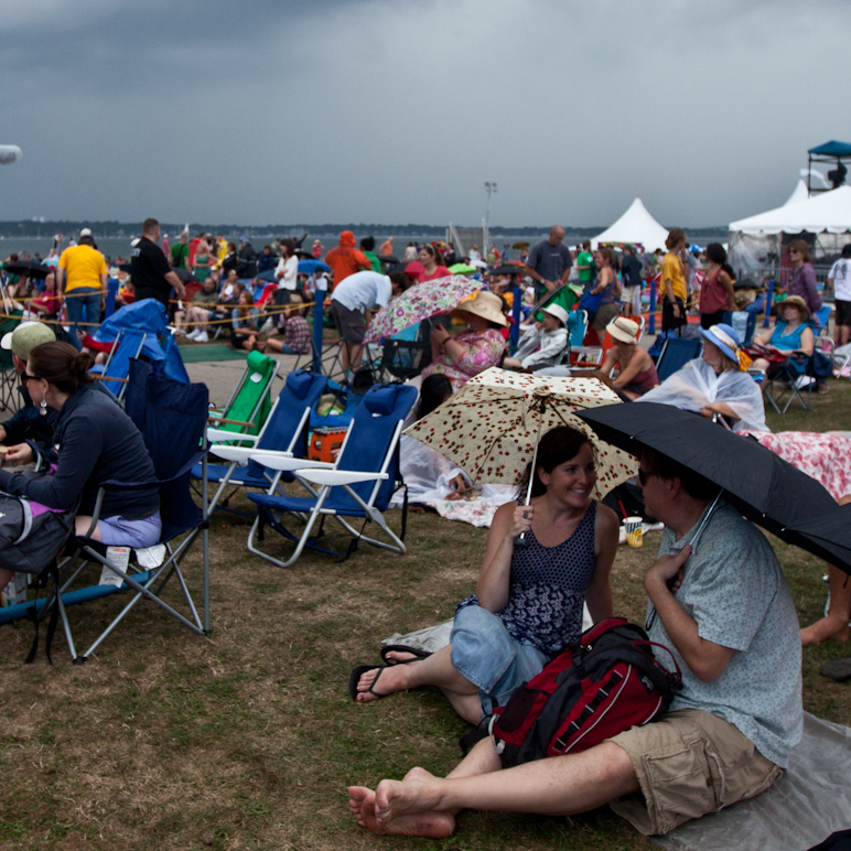 Spectators take cover from the threat of rain at the Newport Folk Festival July 27, 2012. Photo by Erik Jacobs for NPR.