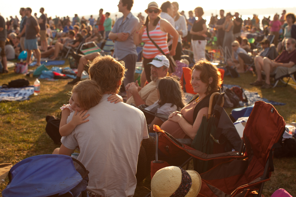 Fans settle in and snuggle up at Fort Adams State Park, surrounded by Newport Harbor and Narragansett Bay in Rhode Island.