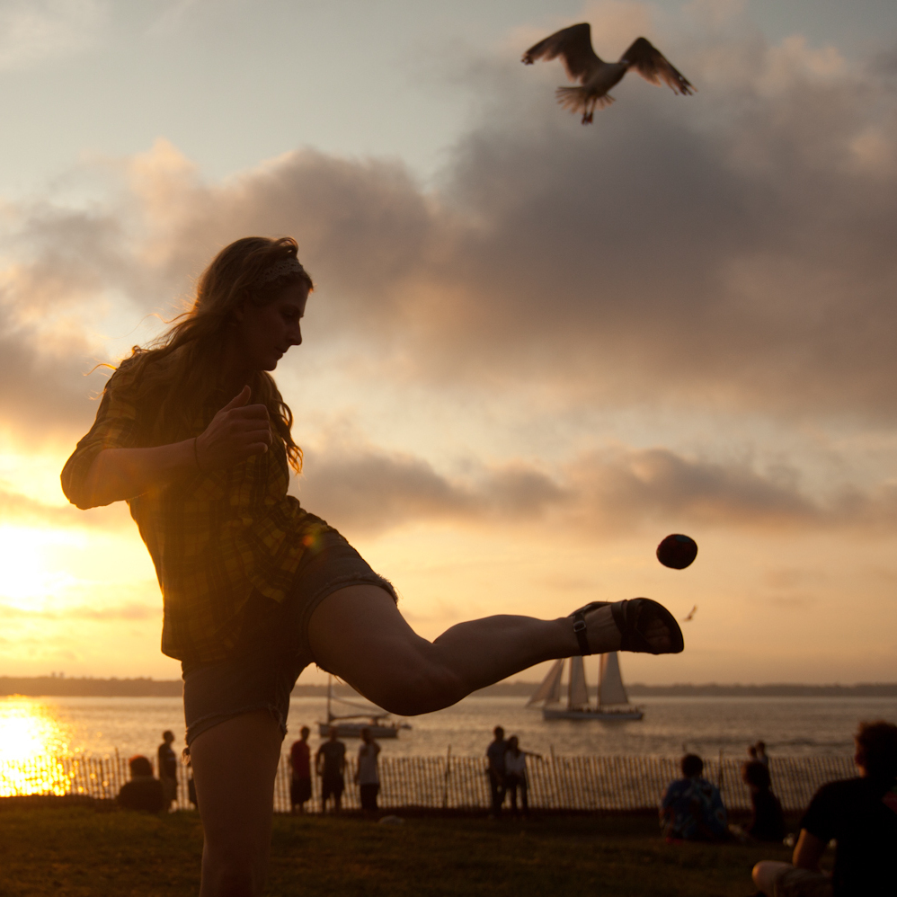 Amy Sullivan of New York City, hacky sacks on the lawn of the Fort Stage at the Newport Folk Festival.