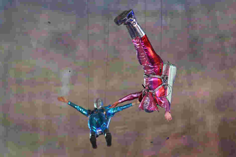 Performers with jet packs take part in the opening ceremony.