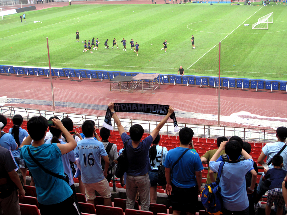 Hardcore fans were allowed to watch a Manchester City training session ahead of a match against rival Arsenal in Beijing's Bird's Nest stadium Friday.