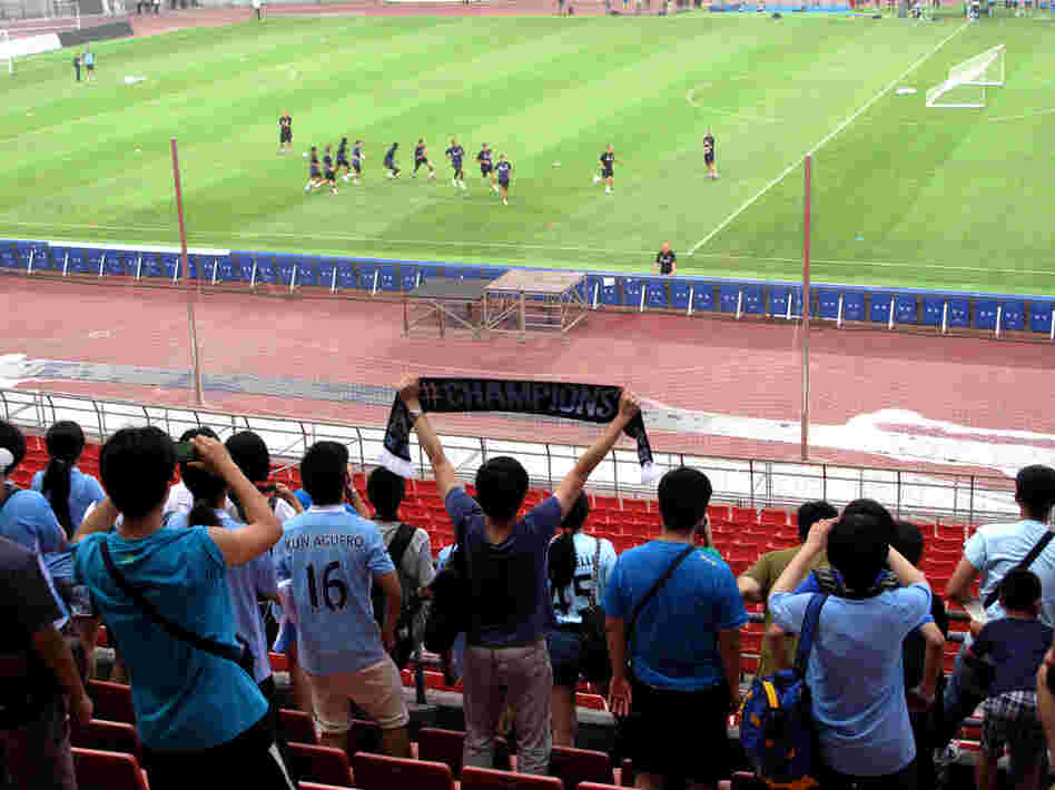 Hardcore fans were allowed to watch a Manchester City training session ahead of a match against rival Arsenal in Beijing's Bird's Nest stadium Friday.