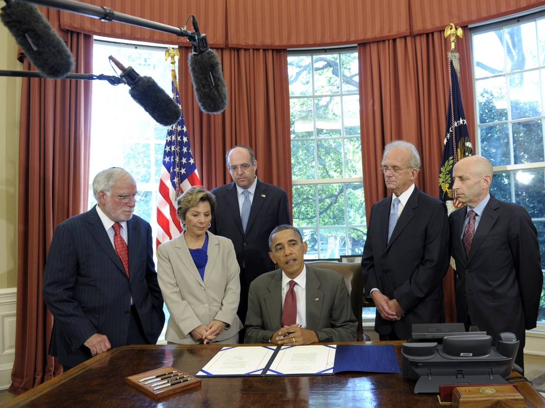 President Obama is flanked Friday by congressional sponsors and officials with the American Israel Public Affairs Committee at a signing ceremony in Washington, D.C., for legislation increasing U.S. security aid to Israel.