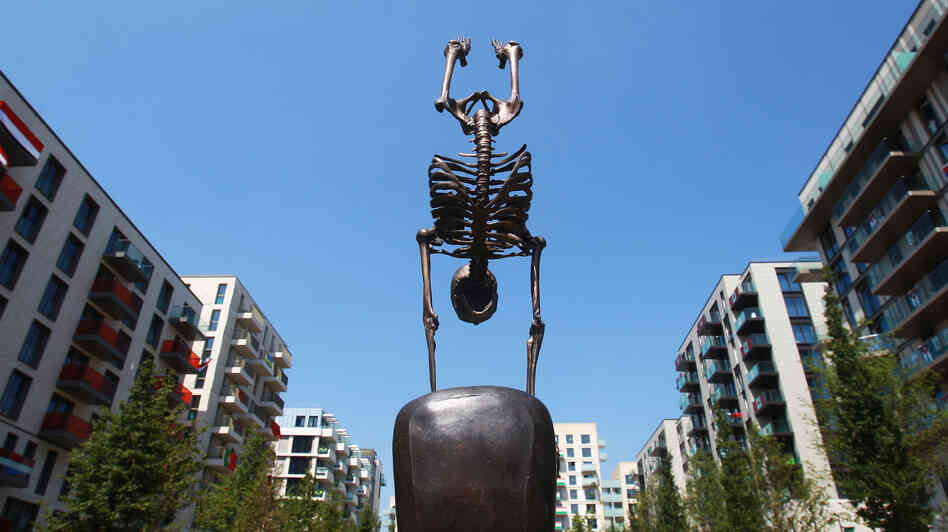 This sculpture of a skeletal gymnast stands in London's Olympic Village, where athletes are preparing for today's Opening Ceremony. If you think it's weird, you're not alone.