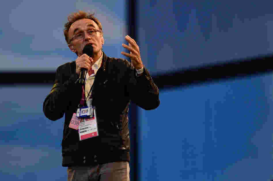 British film director Danny Boyle talks before the ceremony, which he masterminded. The show celebrates British culture, music and literature.