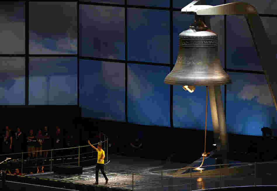 Britain's Bradley Wiggins, who won the Tour de France this year, rings the 23-ton Olympic bell, which was manufactured by the same company that made Big Ben.