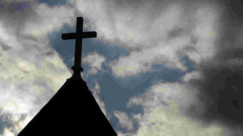 The cross on the steeple of St. Francis Xavier Catholic Church in Henryville, Ind. A recent Gallup poll says only 44 percent of Americans have "great confidence" in organized religion.