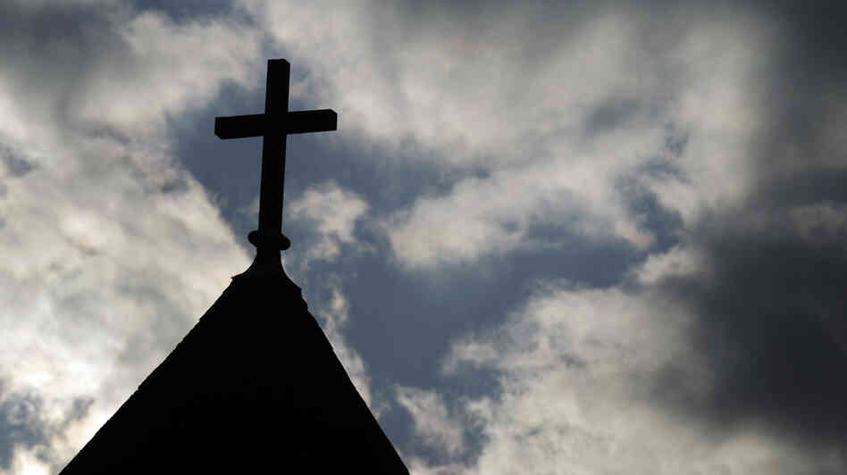 The cross on the steeple of St. Francis Xavier Catholic Church in Henryville, Ind. A recent Gallup poll says only 44 percent of Americans have "great confidence" in organized religion.