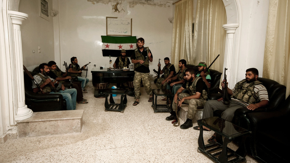 Free Syrian Army fighters are seen in the Syrian town of Azaz, some 20 miles north of Aleppo, on Tuesday.