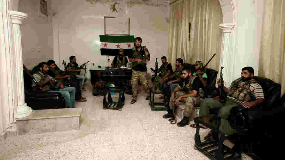 Free Syrian Army fighters are seen in the Syrian town of Azaz, some 20 miles north of Aleppo, on Tuesday.