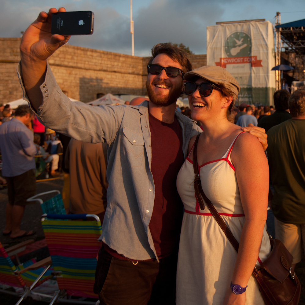 Ben Roberts and Bindy Bassingthwaigthe, both of Melbourne Australia, take a self portrait outside the Fort Stage at the Newport Folk Festival July 27, 2012.