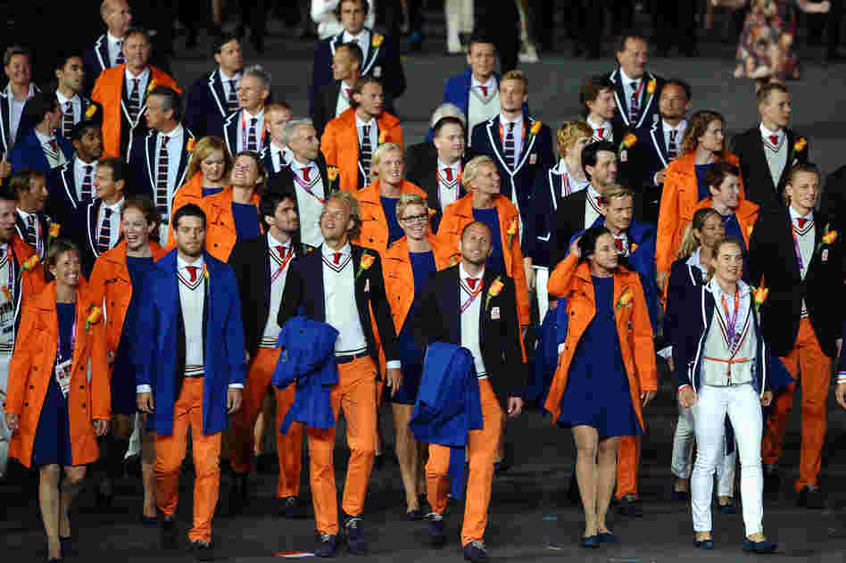 Athletes from the Netherlands walk through the Olympic stadium Friday in London.