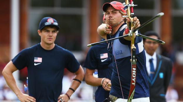 U.S. archer Brady Ellison fires the winning arrow in the men's team archery semifinal Saturday. Ellison and his teammates won the silver, falling just short against Italy in the final.