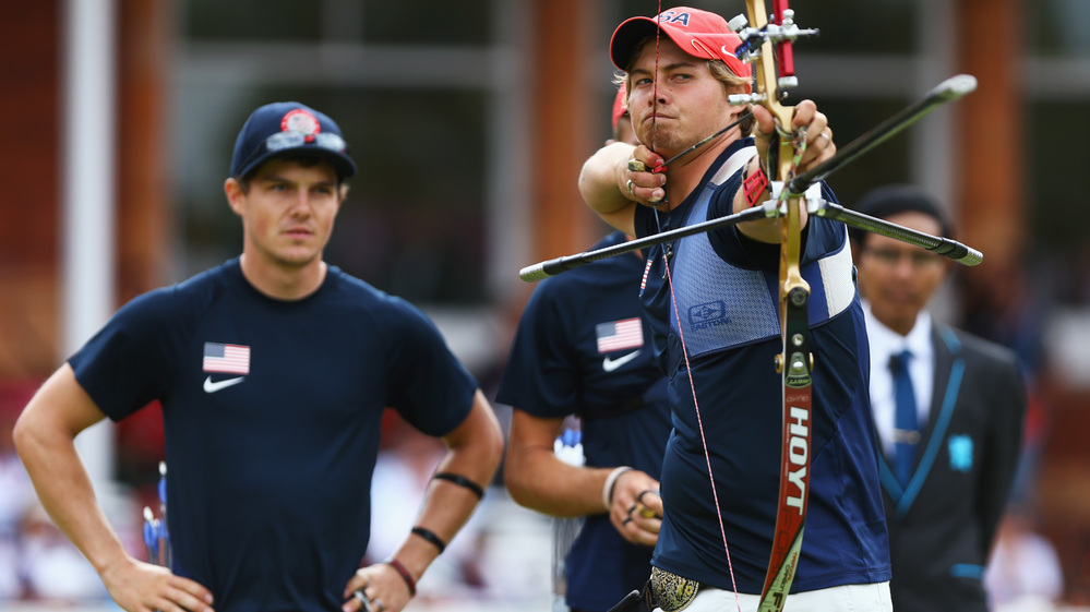 U.S. archer Brady Ellison fires the winning arrow in the men's team archery semifinal Saturday. Ellison and his teammates won the silver, falling just short against Italy in the final.