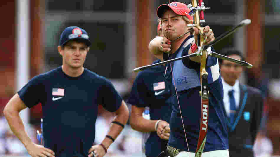 U.S. archer Brady Ellison fires the winning arrow in the men's team archery semifinal Saturday. Ellison and his teammates won the silver, falling just short against Italy in the final.