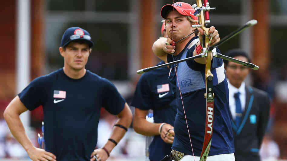 U.S. archer Brady Ellison fires the winning arrow in the men's team archery semifinal Saturday. Ellison and his teammates won the silver, falling just short against Italy in the final.
