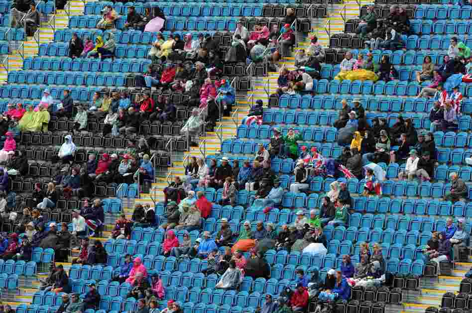Empty seats and spectators are pictured during the dressage event of the eventing competition at the London 2012 Olympic Games in Greenwich Park, London on Sunday.