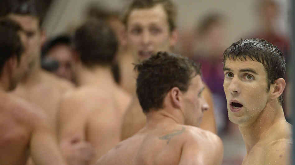United States' Michael Phelps, right, reacts after his team won silver in the men's 4x100-meter freestyle relay final on Sunday.