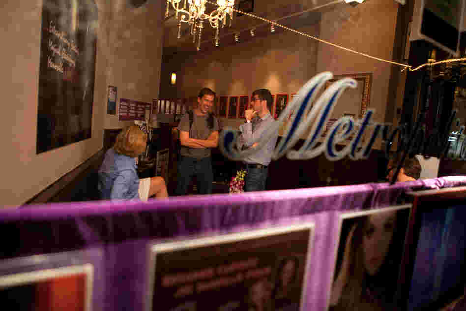 Lynch, center, talks with friends after performing his stand-up routine. He plans to continue trying his hand at amateur comedy, while pursuing a career in anthropology.