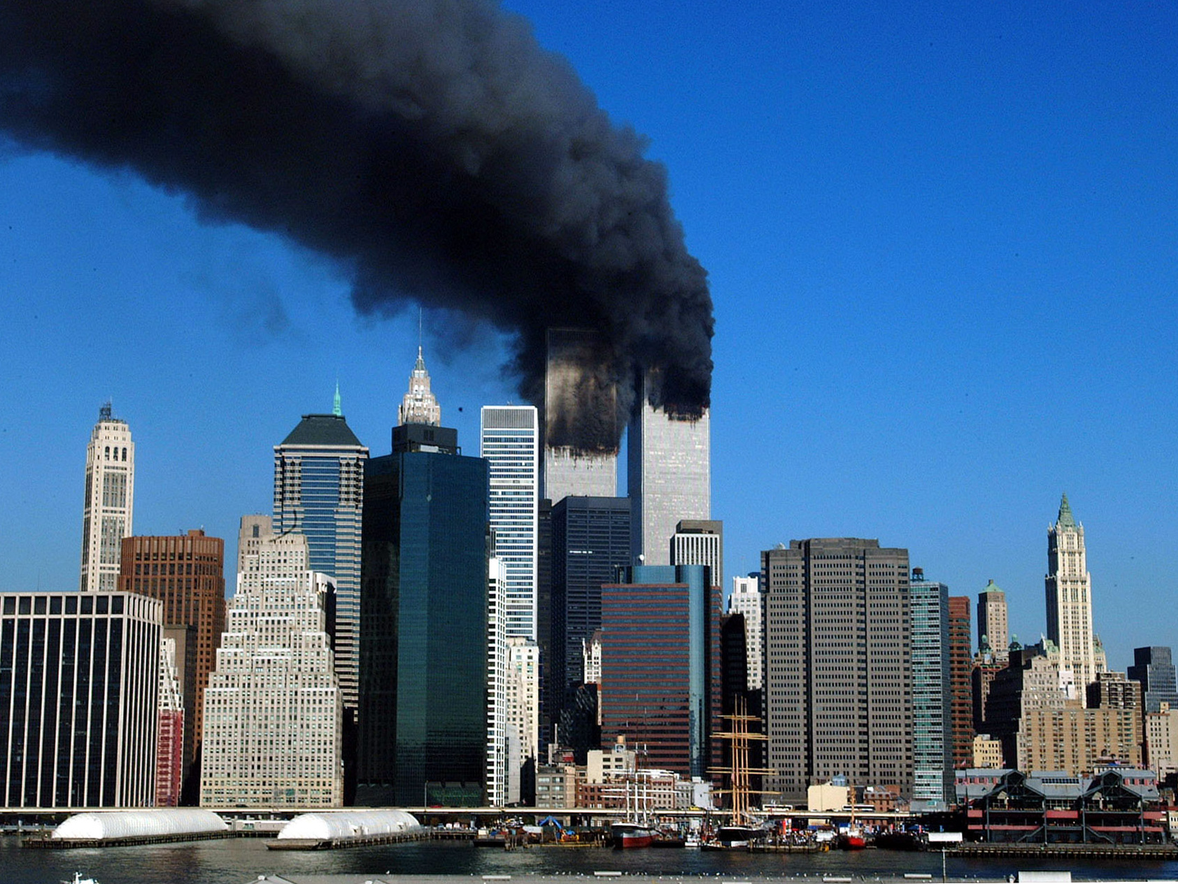 The twin towers of the World Trade Center billow smoke after hijacked airliners crashed into them early 11 September, 2001.