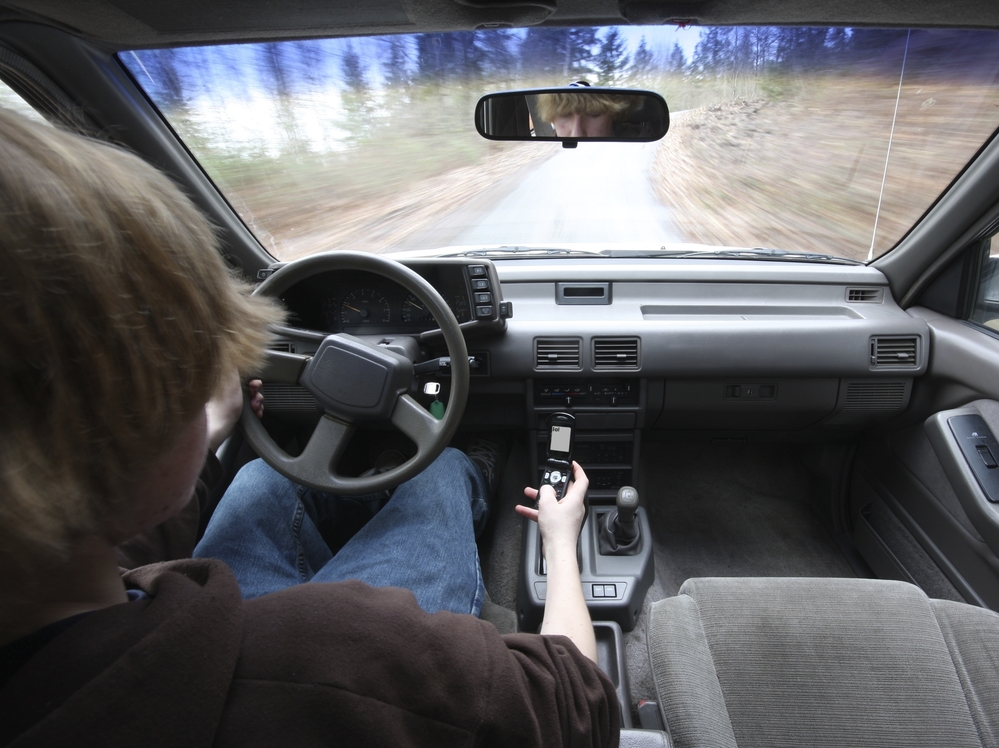 Drivers under 25 are more likely to send text messages and make calls behind the wheel. They're also less able to handle distractions while driving.