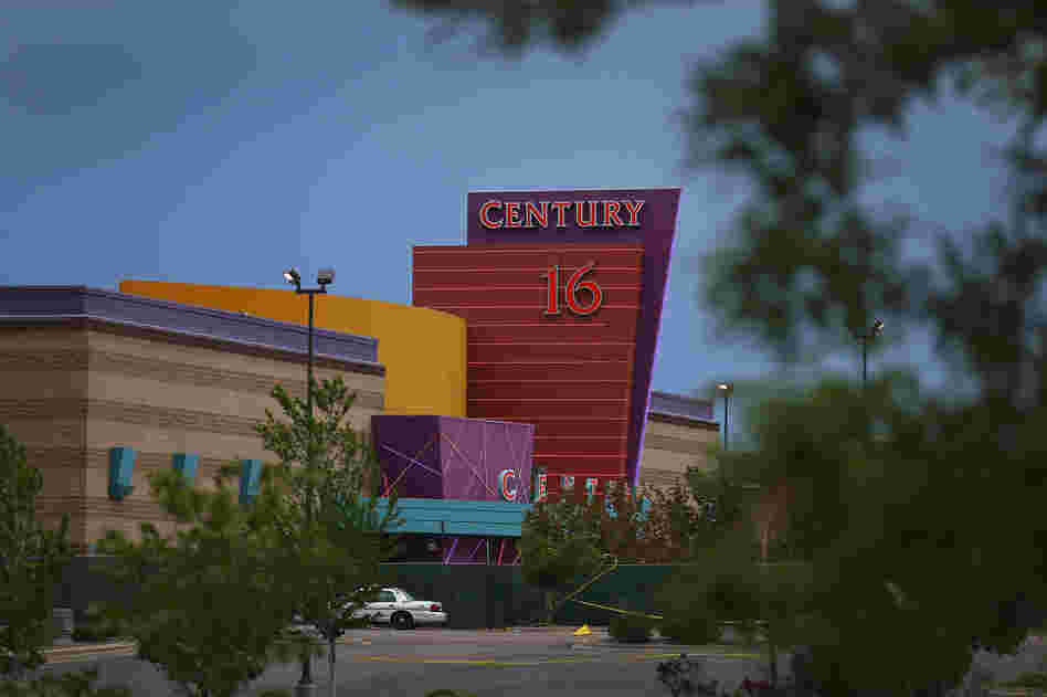 The Century 16 movie theatre is seen from a memorial setup across the street on July 28, in Aurora, Colorado.