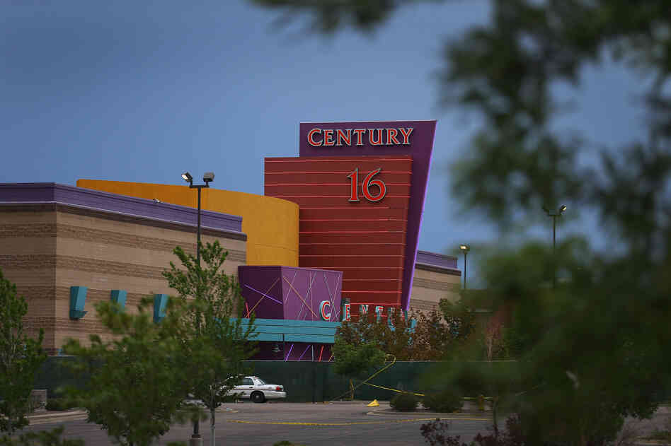 The Century 16 movie theatre is seen from a memorial setup across the street on July 28, in Aurora, Colorado.