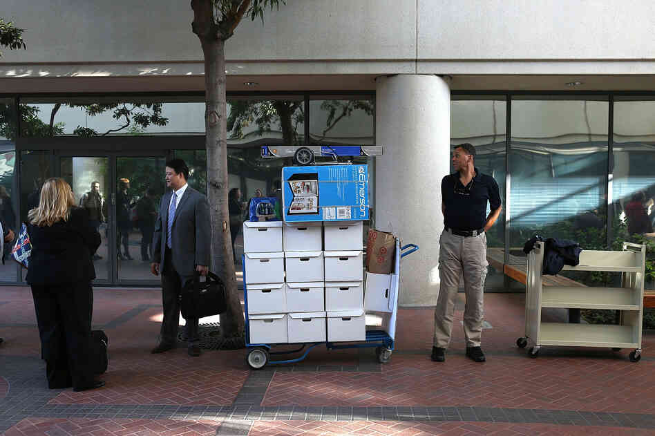 Samsung Electronics Co. representatives wait to enter the Robert F. Peckham Federal Courthouse in San Jose, California on Monday.