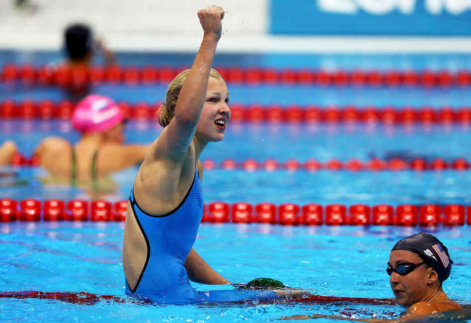 Ruta Meilutyte of Lithuania celebrates following her win in the women's 100m breaststroke final. 