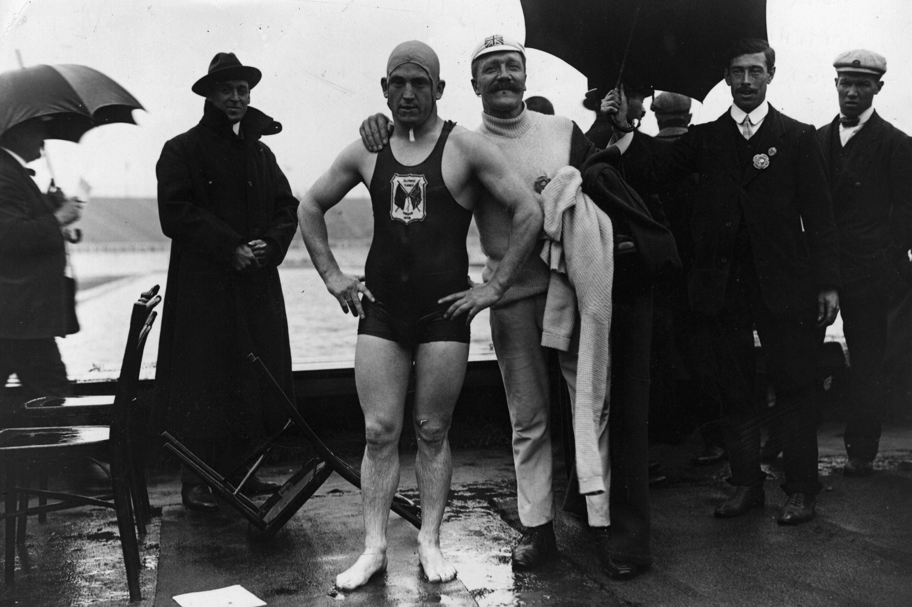 British swimmer Henry Taylor, who won a 400 meter race, with his trainer.