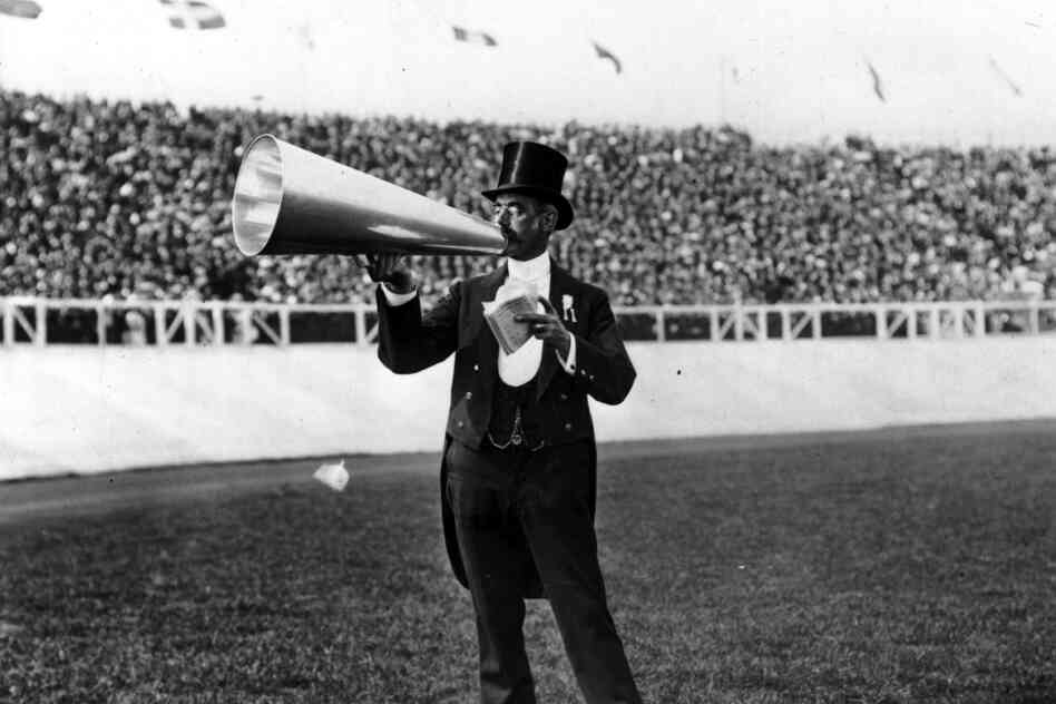 The master of ceremonies using a megaphone.