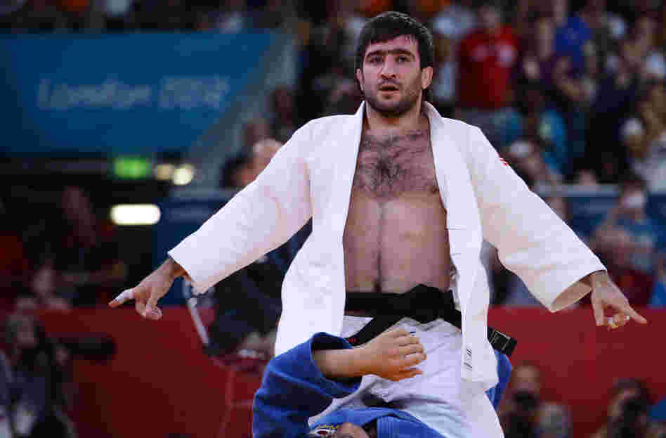 Russia's Mansur Isaev reacts after defeating Riki Nakaya of Japan during the men's 73kg judo finals.