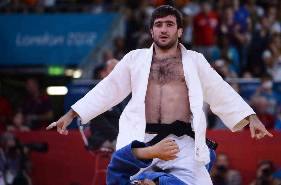 Russia's Mansur Isaev reacts after defeating Riki Nakaya of Japan during the men's 73kg judo finals.