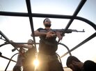 Syrian rebels patrol the streets near Aleppo, Syria. Syrian rebels patrol the streets near Aleppo, Syria.