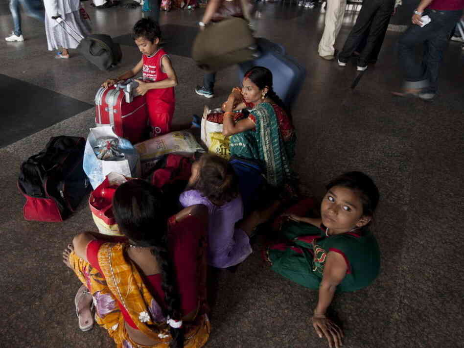 Passengers in New Delhi were waiting for trains that couldn't run because of Monday's power outage.