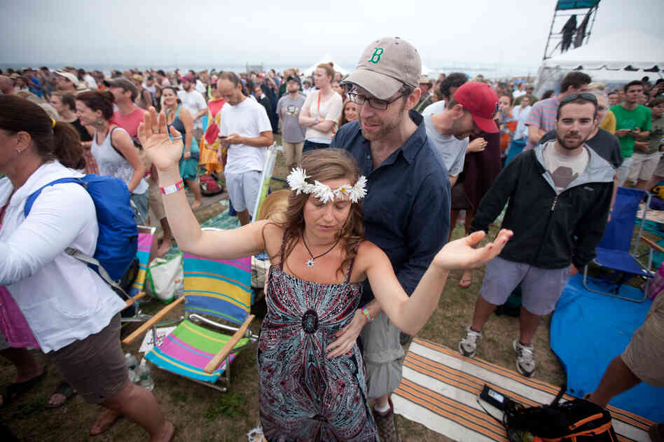 Marinda Snow and Brian Geraghty, both of Cambridge, Mass., get all flower child at My Morning Jacket.