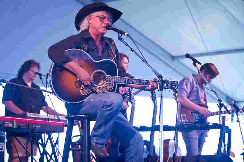 Woody Guthrie's son, Arlo, played with The Guthrie Family Reunion at the Newport Folk Festival moments before being joined by his grandchildren on stage.