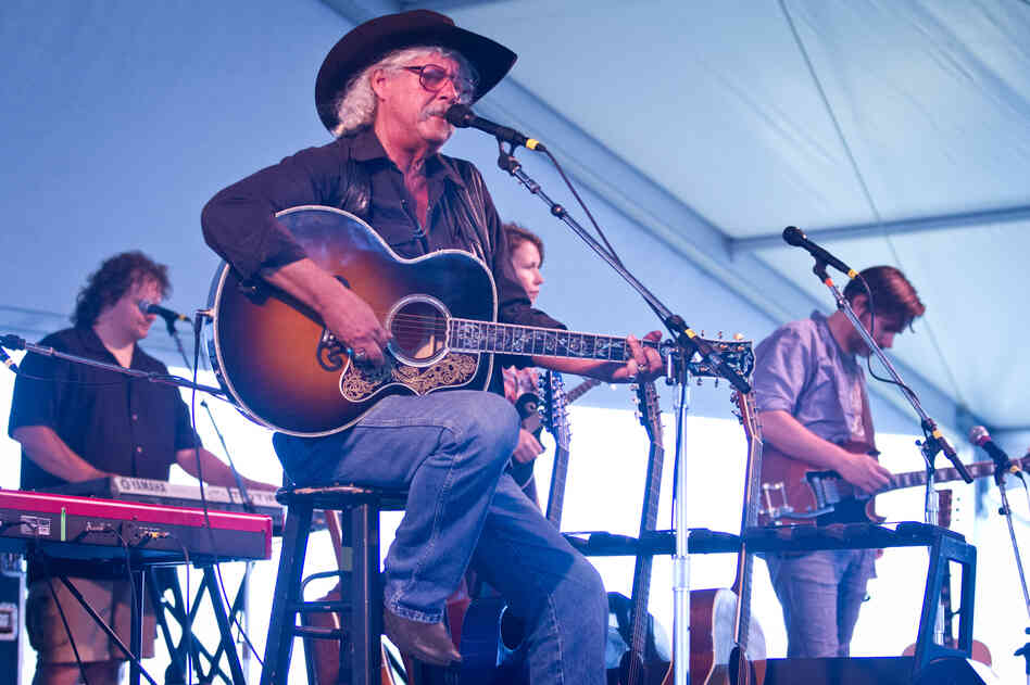 Woody Guthrie's son, Arlo, played with The Guthrie Family Reunion at the Newport Folk Festival moments before being joined by his grandchildren on stage.