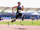 Oscar Pistorius of South Africa runs in the men's 200-meter event at the Paralympic World Cup in May. Some observers have suggested Pistorius receives an unfair advantage from his carbon-fiber "blade" legs. Oscar Pistorius of South Africa runs in the men's 200-meter event at the Paralympic World Cup in May. Some observers have suggested Pistorius receives an unfair advantage from his carbon-fiber "blade" legs.