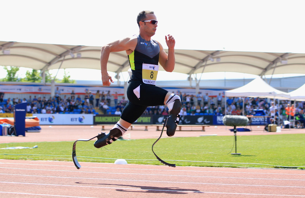 Oscar Pistorius of South Africa runs in the men's 200-meter event at the Paralympic World Cup in May. Some observers have suggested Pistorius receives an unfair advantage from his carbon-fiber "blade" legs.