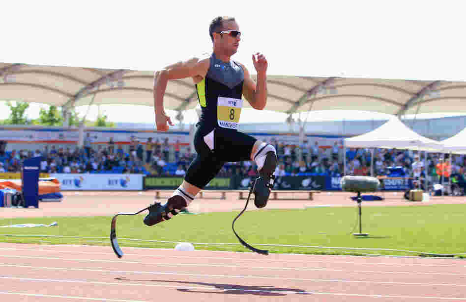 Oscar Pistorius of South Africa runs in the men's 200-meter event at the Paralympic World Cup in May. Some observers have suggested Pistorius receives an unfair advantage from his carbon-fiber "blade" legs.