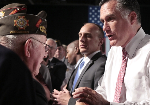 Republican presidential candidate Mitt Romney meets with members of the Veterans of Foreign Wars after his speech at the VFW National Convention in Reno, Nev., on July 24.