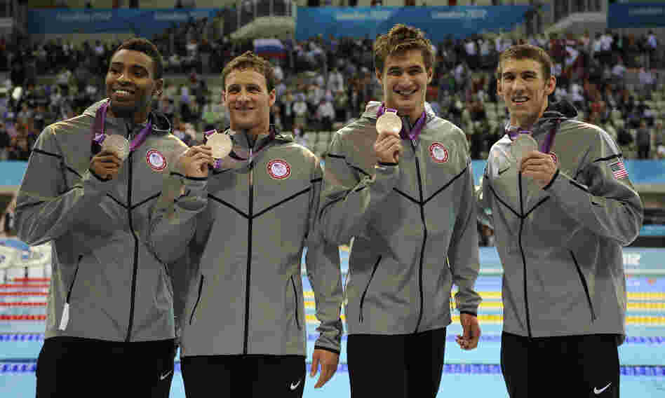 Americans Cullen Jones (from left), Ryan Lochte, Nathan Adrian and Michael Phelps pose with their silver medals for the men's 4x100-meter freestyle relay at the Aquatics Centre on Sunday.