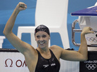 American Dana Vollmer celebrates after her gold medal win Sunday in the women's 100-meter butterfly swimming final at the Aquatics Centre in the Olympic Park. American Dana Vollmer celebrates after her gold medal win Sunday in the women's 100-meter butterfly swimming final at the Aquatics Centre in the Olympic Park.
