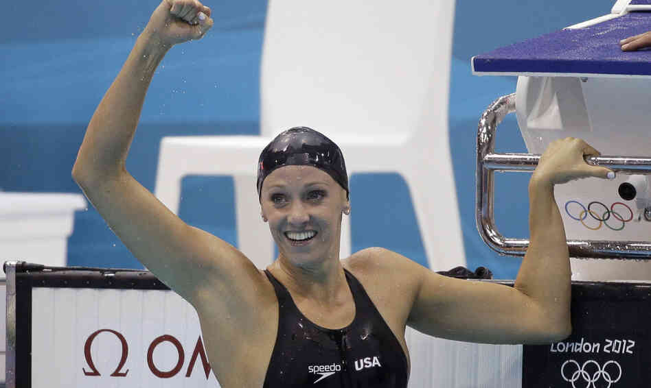 American Dana Vollmer celebrates after her gold medal win Sunday in the women's 100-meter butterfly swimming final at the Aquatics Centre in the Olympic Park.