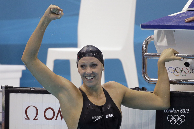 American Dana Vollmer celebrates after her gold medal win Sunday in the women's 100-meter butterfly swimming final at the Aquatics Centre in the Olympic Park.