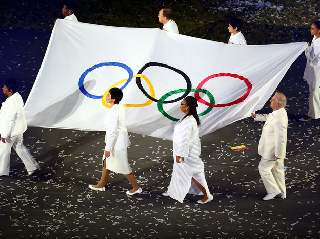 Conductor Daniel Barenboim (lower right) was one of eight notables chosen to carry the Olympic flag at the July 27 opening ceremony of the London Games.