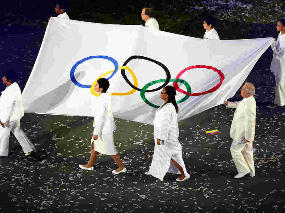 Conductor Daniel Barenboim (lower right) was one of eight notables chosen to carry the Olympic flag at the July 27 opening ceremony of the London Games.
