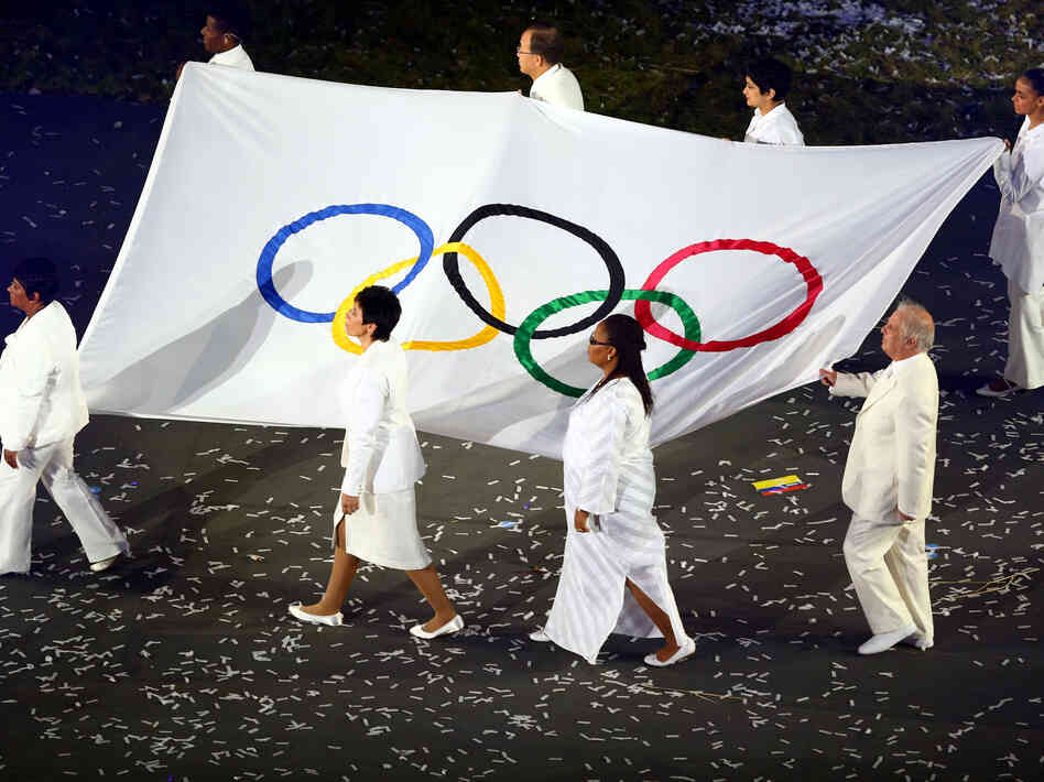 Conductor Daniel Barenboim (lower right) was one of eight notables chosen to carry the Olympic flag at the July 27 opening ceremony of the London Games.