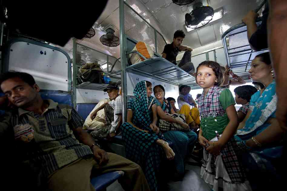 Passengers wait on a train during the power outage in New Delhi on Tuesday. The crisis affected an estimated 670 million people.